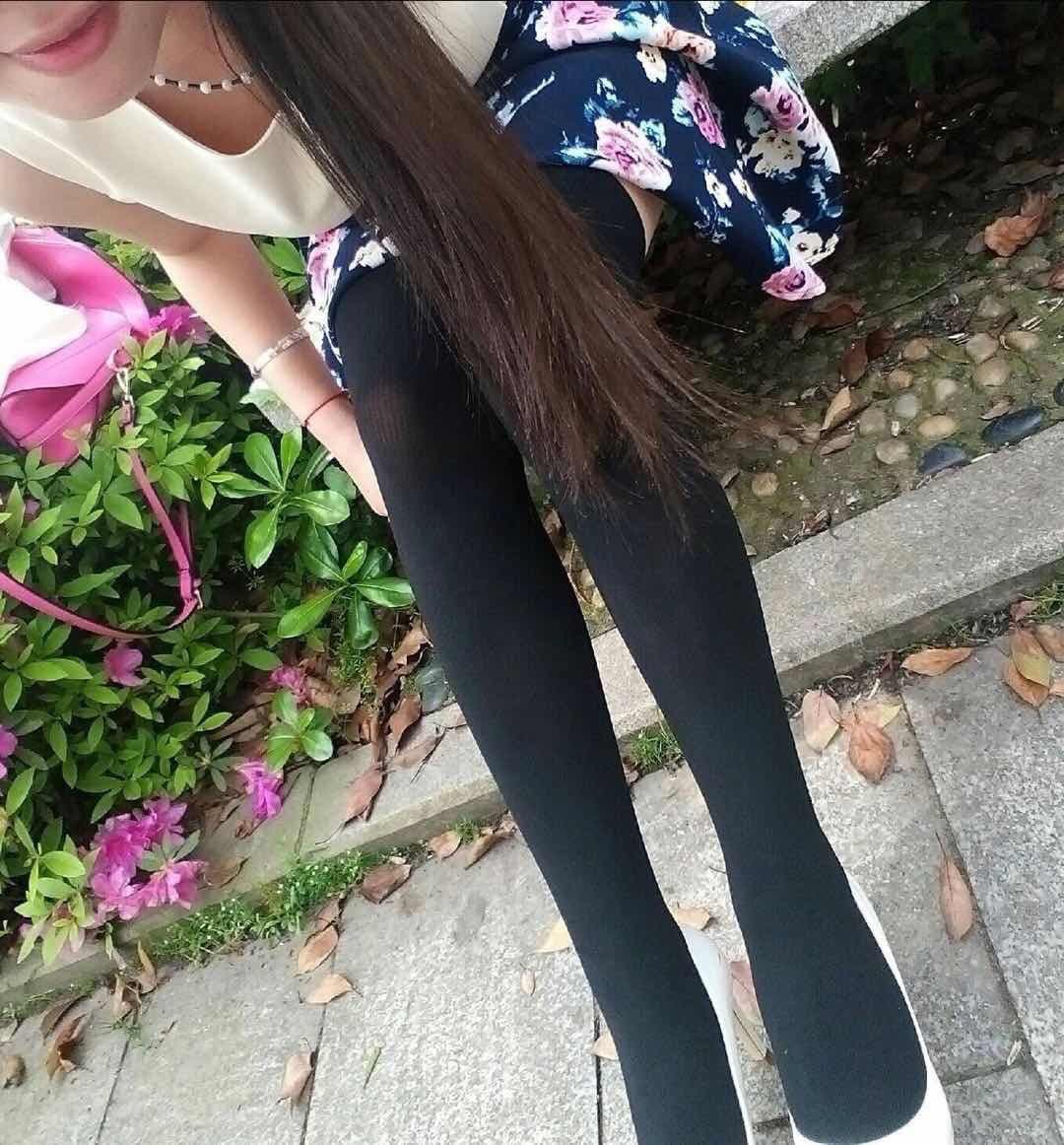 Sheer pantyhose hugging a foot and ankle, subtle sheen and tiny fabric texture visible in soft studio light